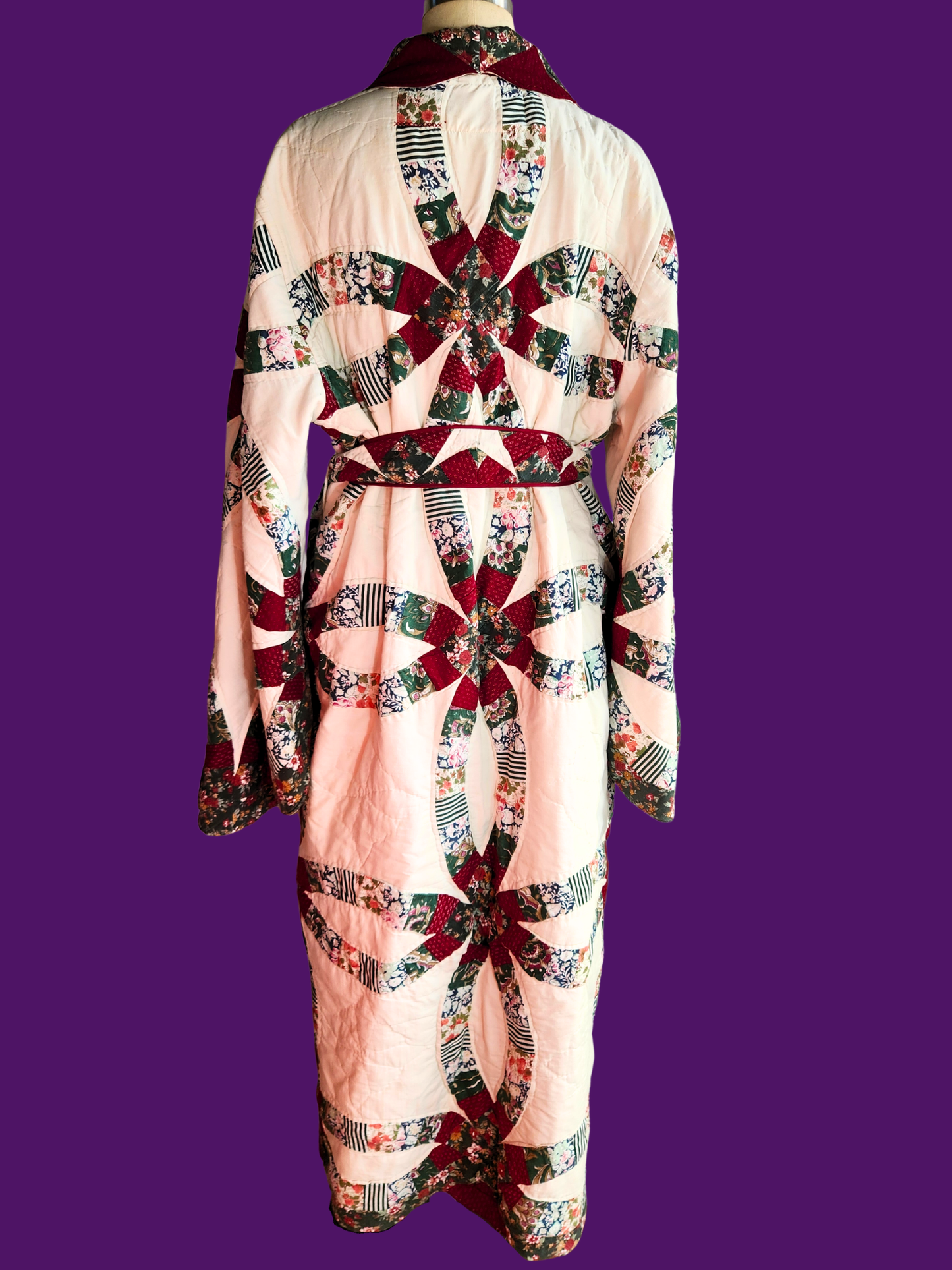 Quilted garment with a colorful pattern on a purple background