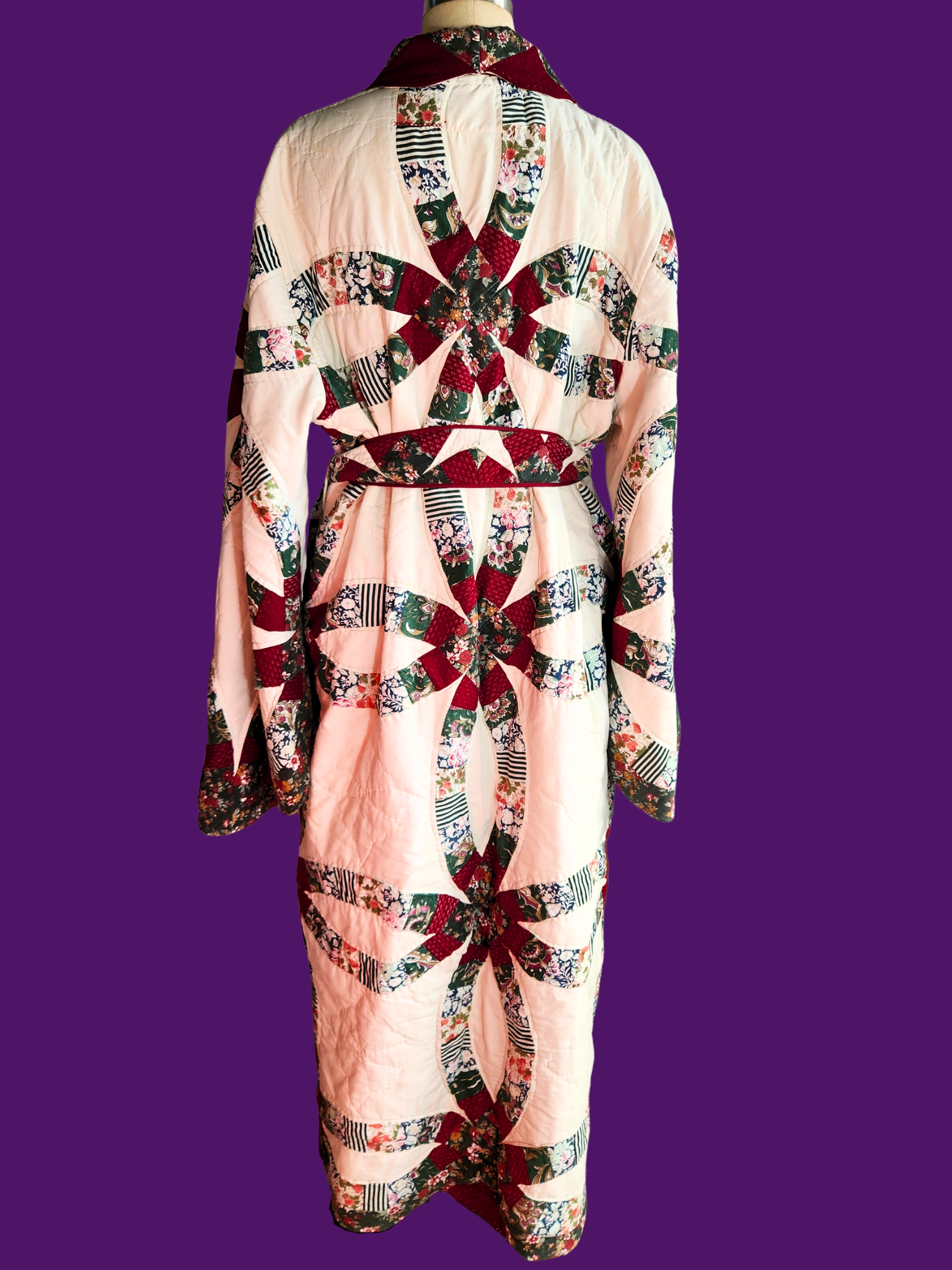 Quilted garment with a colorful pattern on a purple background