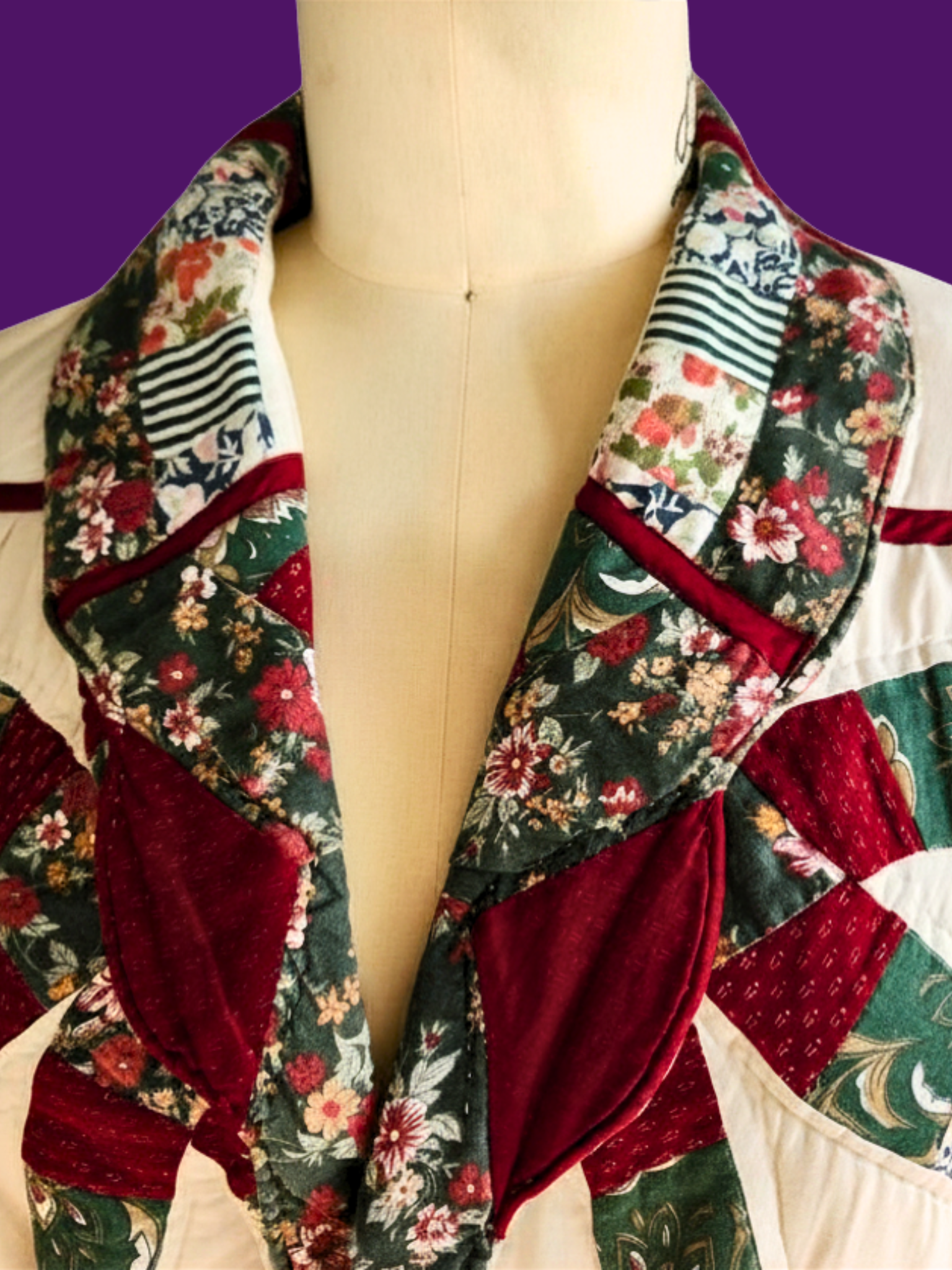 Mannequin wearing a floral patchwork dress with a deep neckline on a purple background