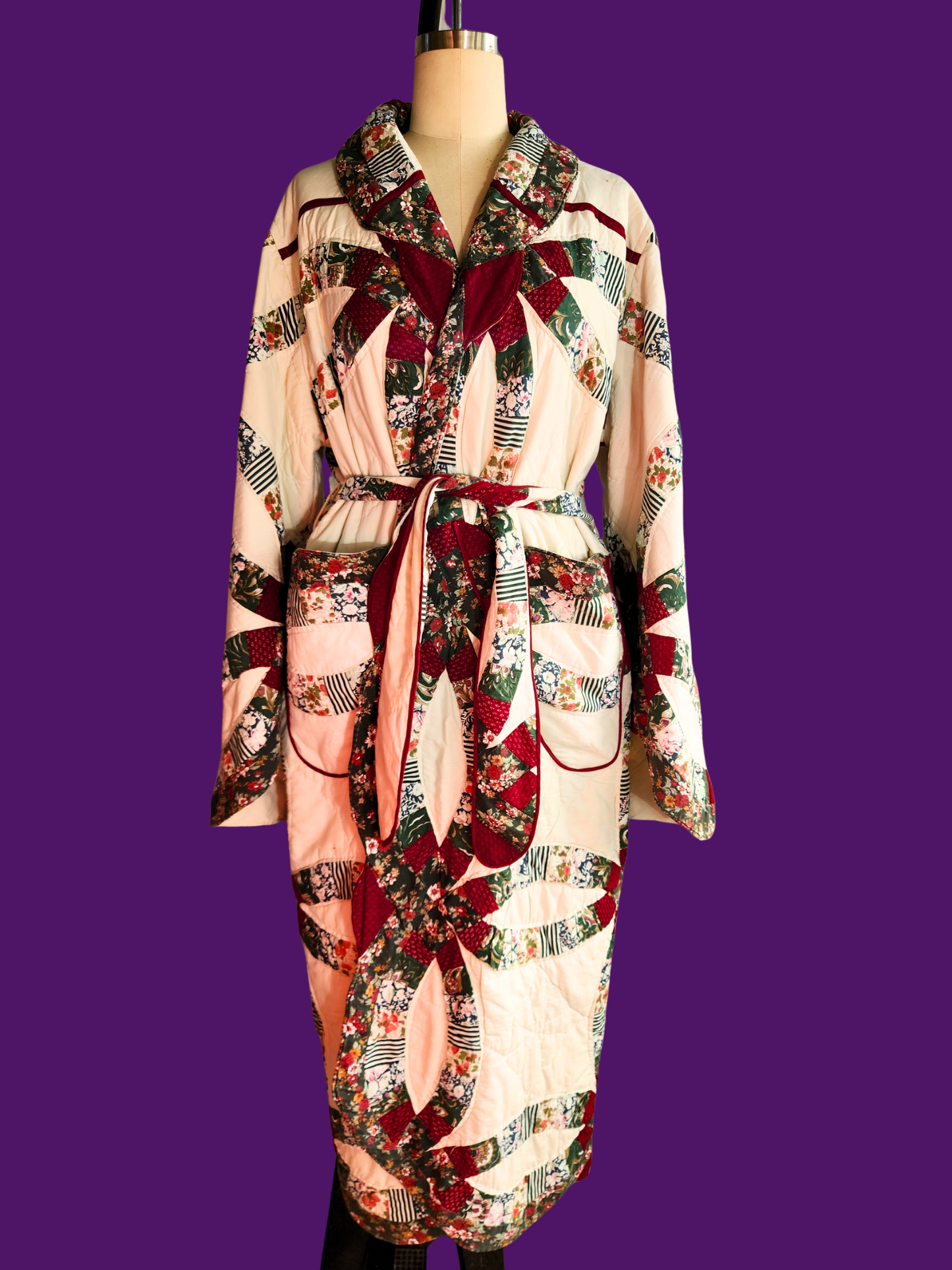 Patterned robe on a mannequin against a purple background