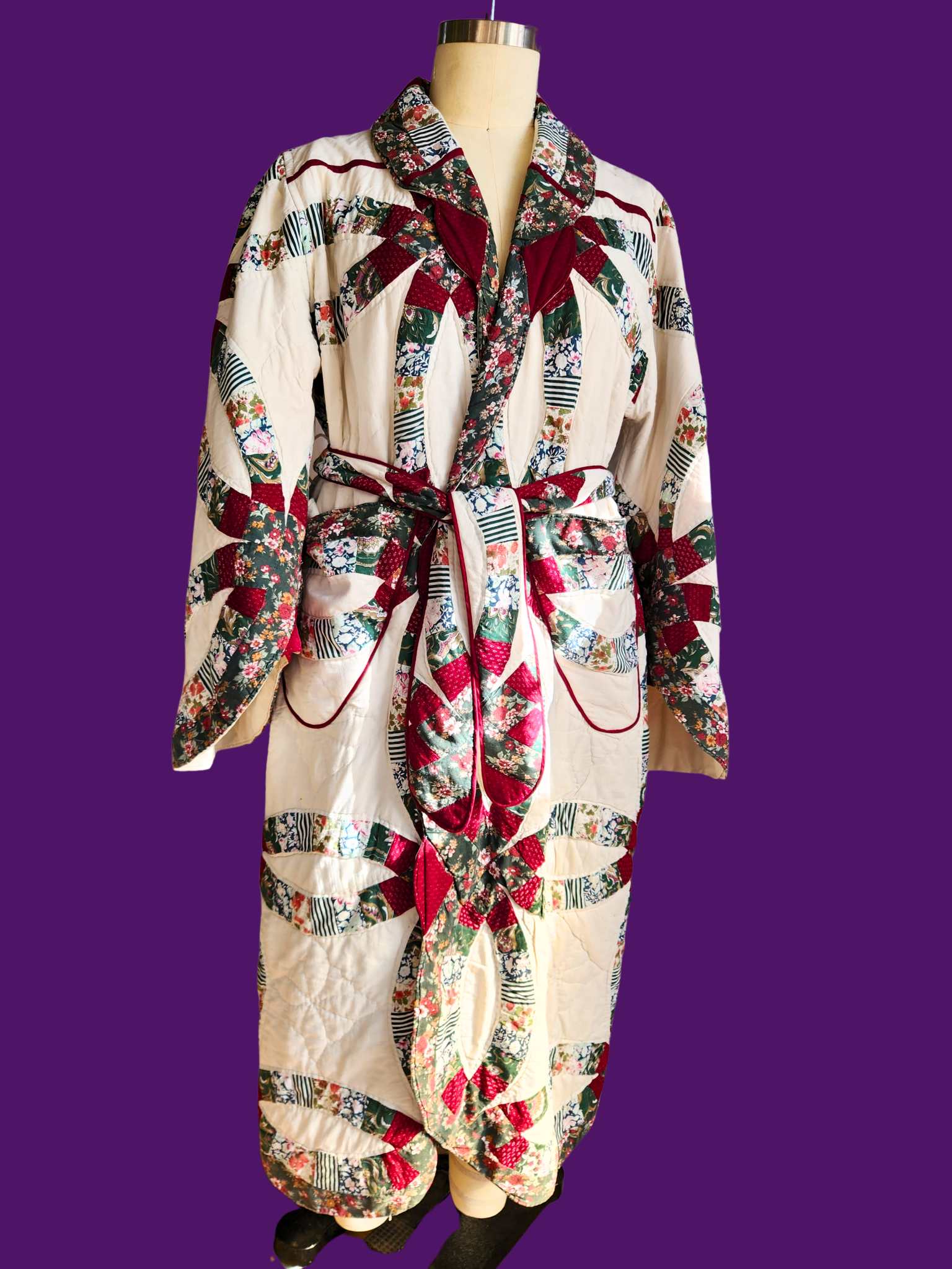Colorful robe with pattern on a mannequin against a purple background