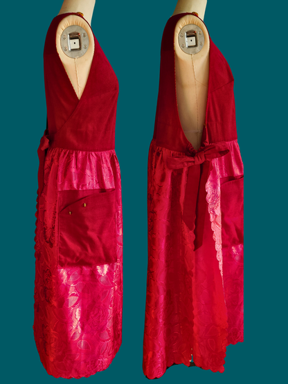 Red dress on a mannequin against a teal background