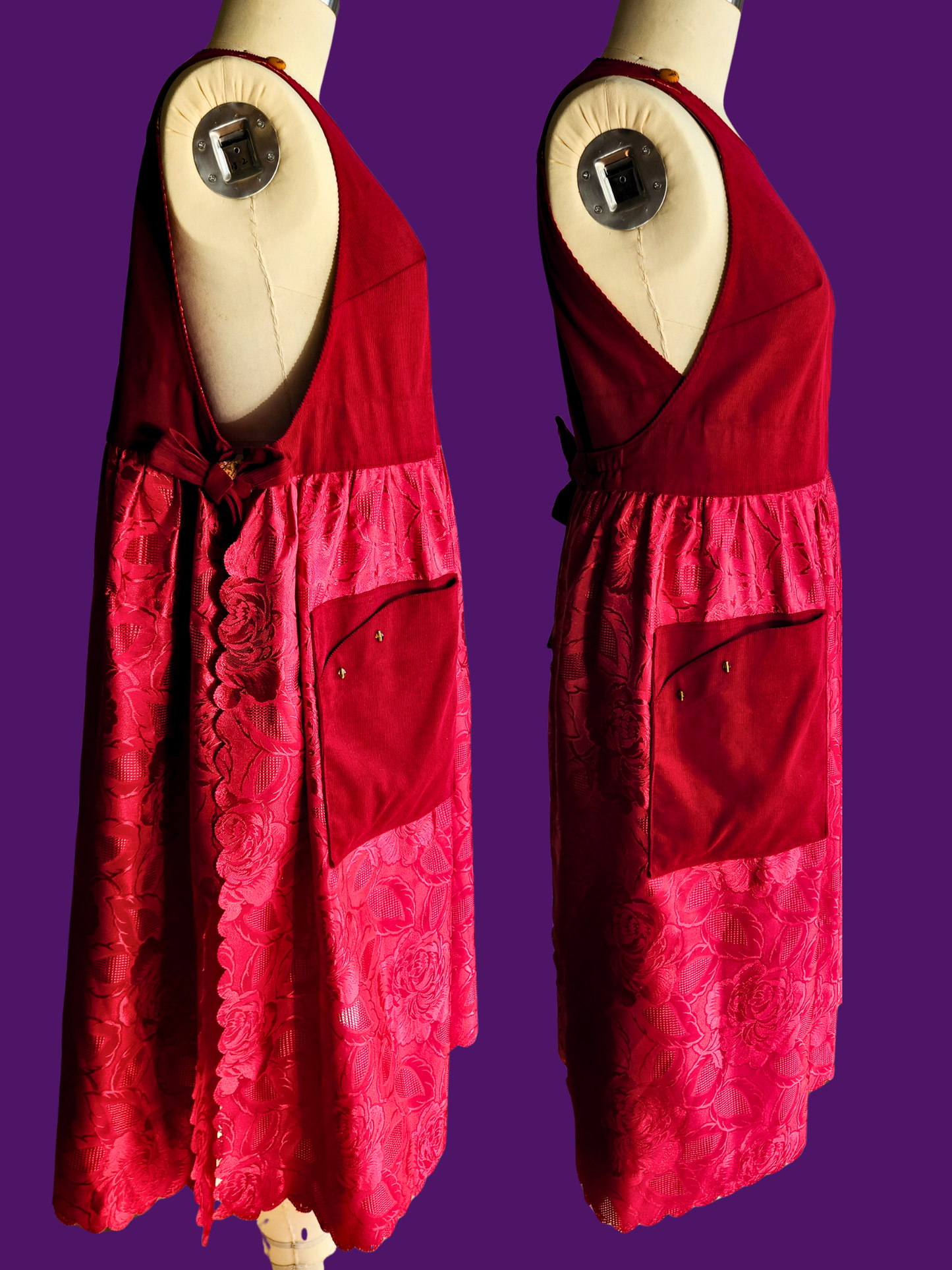 Red dress on a mannequin against a purple background