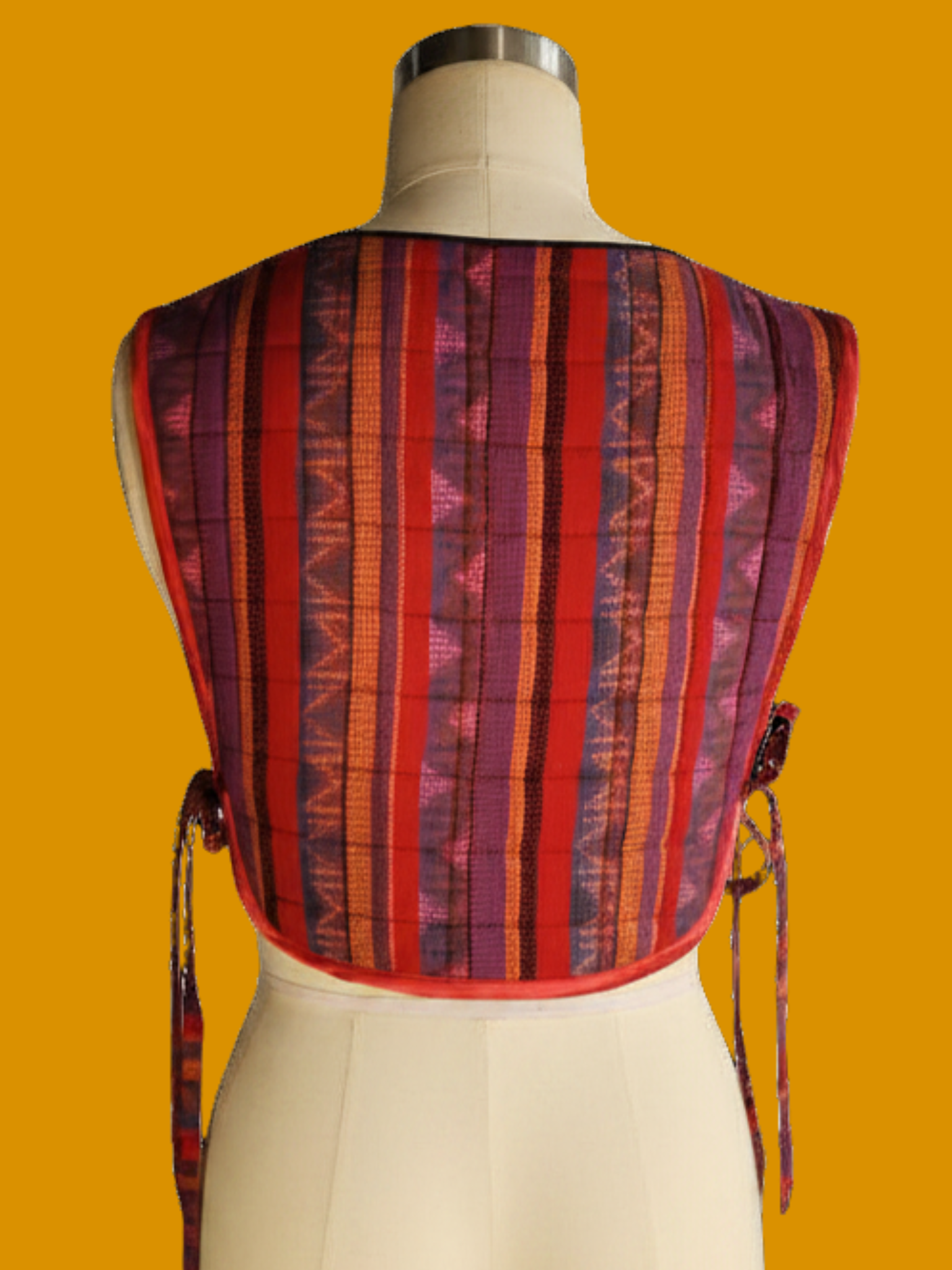 Striped garment on a mannequin against a yellow background