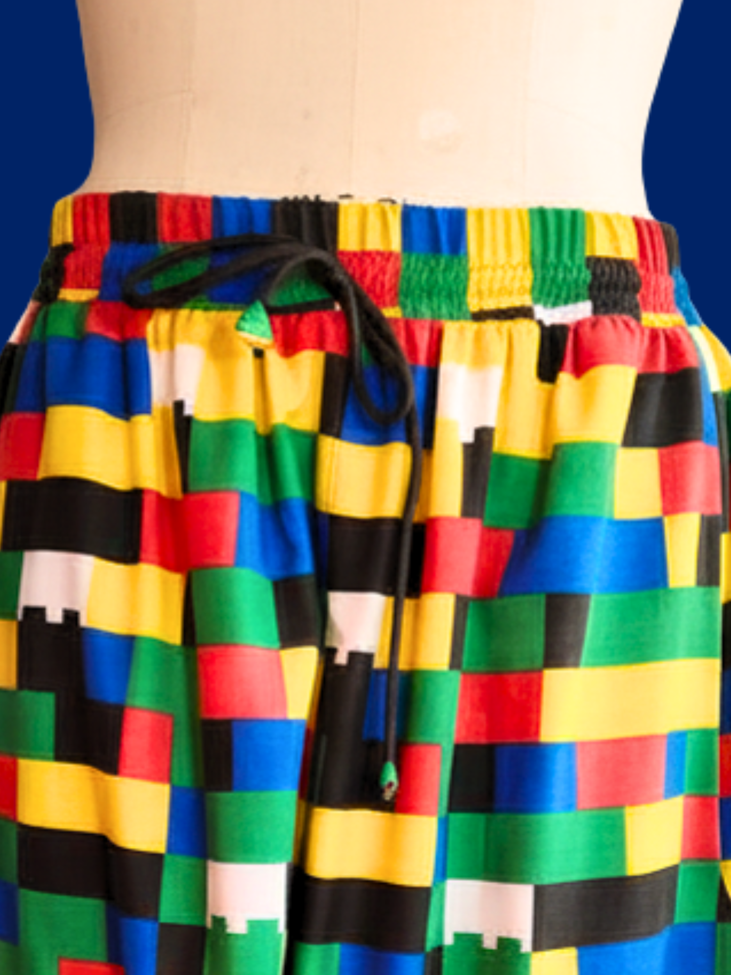 Colorful checkered pants with a blue background