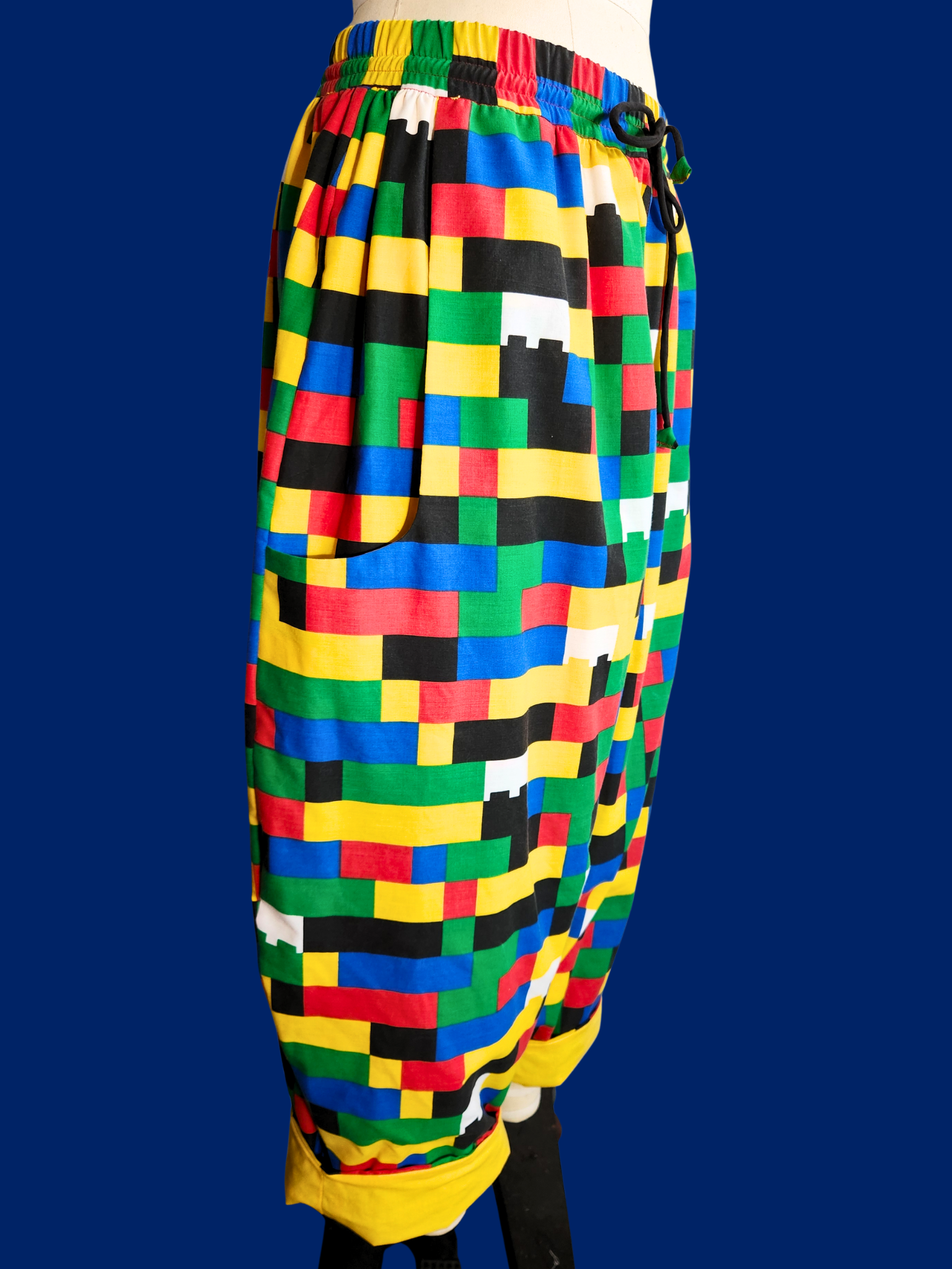 Colorful checkered pants on a dark blue background